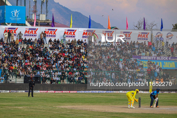 Spectators watch a cricket match during the Legends League Cricket match between Toyam Hyderabad and Southern Super Stars in Srinagar, Jammu...