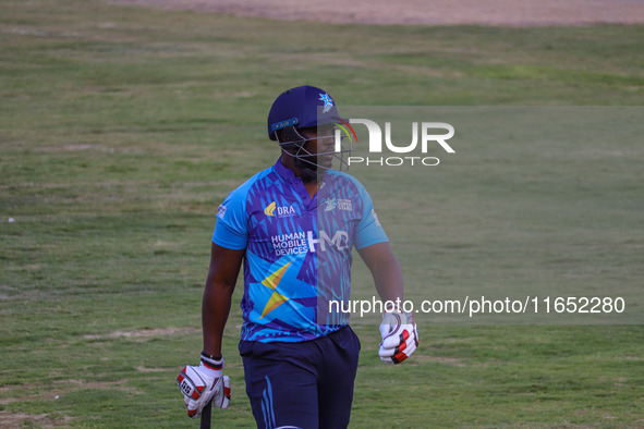 Zimbabwe's Elton Chigumbura walks off after being dismissed during the Legends League Cricket match between Toyam Hyderabad and Southern Sup...