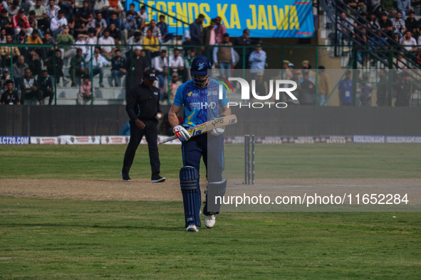 New Zealand's Martin Guptill walks off after being dismissed by Ravi Jangid of India during the Legends League Cricket match between Toyam H...