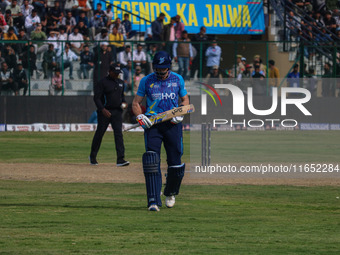 New Zealand's Martin Guptill walks off after being dismissed by Ravi Jangid of India during the Legends League Cricket match between Toyam H...