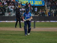 New Zealand's Martin Guptill walks off after being dismissed by Ravi Jangid of India during the Legends League Cricket match between Toyam H...