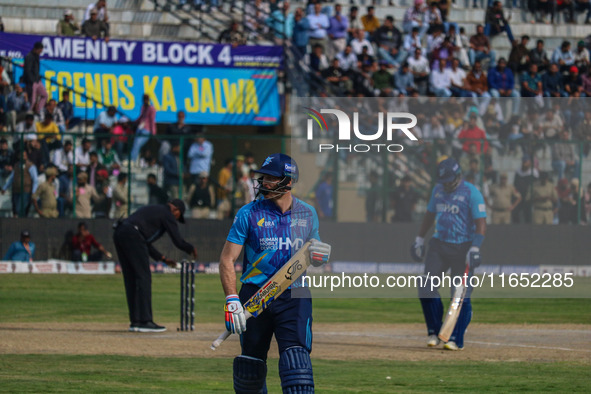 New Zealand's Martin Guptill walks off after being dismissed by Ravi Jangid of India during the Legends League Cricket match between Toyam H...