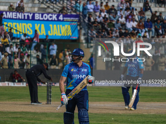 New Zealand's Martin Guptill walks off after being dismissed by Ravi Jangid of India during the Legends League Cricket match between Toyam H...