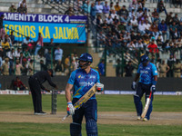 New Zealand's Martin Guptill walks off after being dismissed by Ravi Jangid of India during the Legends League Cricket match between Toyam H...