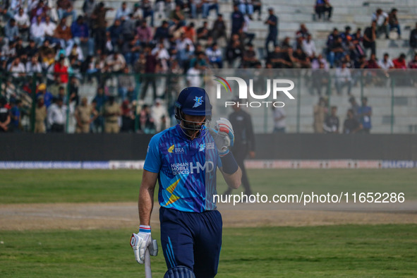 New Zealand's Martin Guptill walks off after being dismissed by Ravi Jangid of India during the Legends League Cricket match between Toyam H...