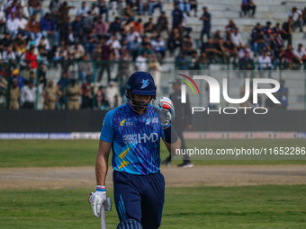 New Zealand's Martin Guptill walks off after being dismissed by Ravi Jangid of India during the Legends League Cricket match between Toyam H...