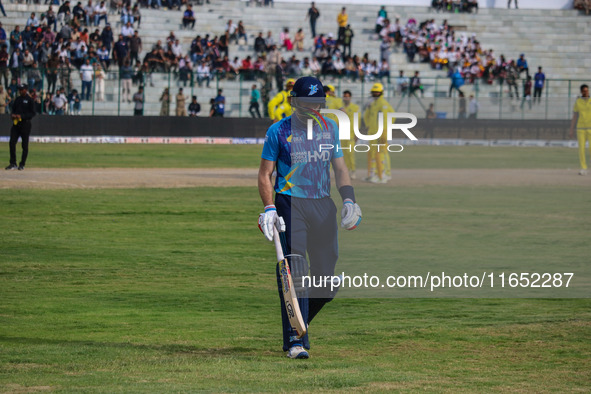 New Zealand's Martin Guptill walks off after being dismissed by Ravi Jangid of India during the Legends League Cricket match between Toyam H...