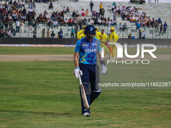 New Zealand's Martin Guptill walks off after being dismissed by Ravi Jangid of India during the Legends League Cricket match between Toyam H...