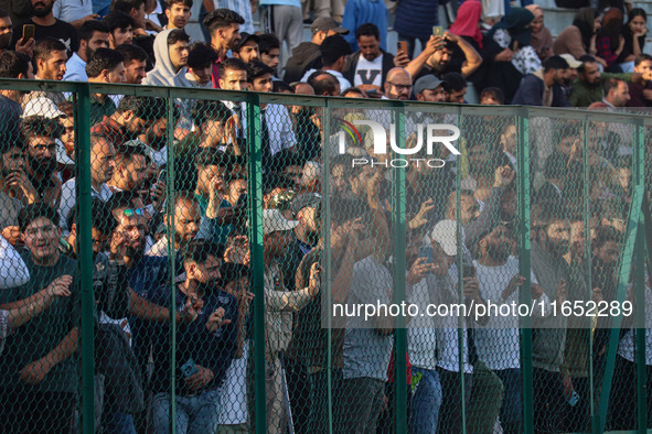 Spectators watch a cricket match during the Legends League Cricket match between Toyam Hyderabad and Southern Super Stars in Srinagar, Jammu...