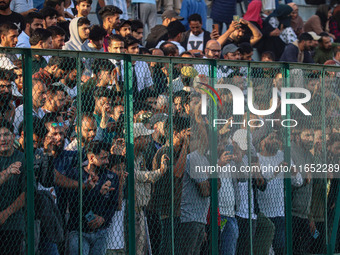 Spectators watch a cricket match during the Legends League Cricket match between Toyam Hyderabad and Southern Super Stars in Srinagar, Jammu...