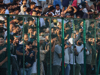 Spectators watch a cricket match during the Legends League Cricket match between Toyam Hyderabad and Southern Super Stars in Srinagar, Jammu...