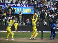 India's Kedar Jadhav (right), United States's Jaskaran Malhotra (center), and India's Gurkeerat Singh Mann (left) participate in the Legends...