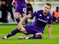 Pietro Comuzzo of ACF Fiorentina lies down on the pitch during the Serie A Enilive match between ACF Fiorentina and AC Milan at Stadio Artem...