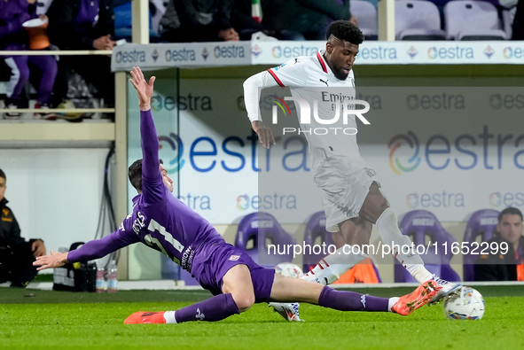 Emerson Royal of AC Milan and Robin Gosens of ACF Fiorentina compete for the ball during the Serie A Enilive match between ACF Fiorentina an...