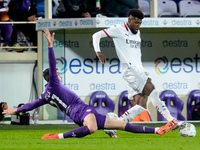 Emerson Royal of AC Milan and Robin Gosens of ACF Fiorentina compete for the ball during the Serie A Enilive match between ACF Fiorentina an...