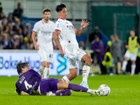 Edoardo Bove of ACF Fiorentina and Tijjani Reijnders of AC Milan compete for the ball during the Serie A Enilive match between ACF Fiorentin...