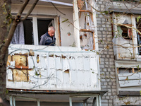 A man stands on the balcony of a residential building damaged by a Russian drone attack in Chornomorsk, Odesa region, southern Ukraine, on O...