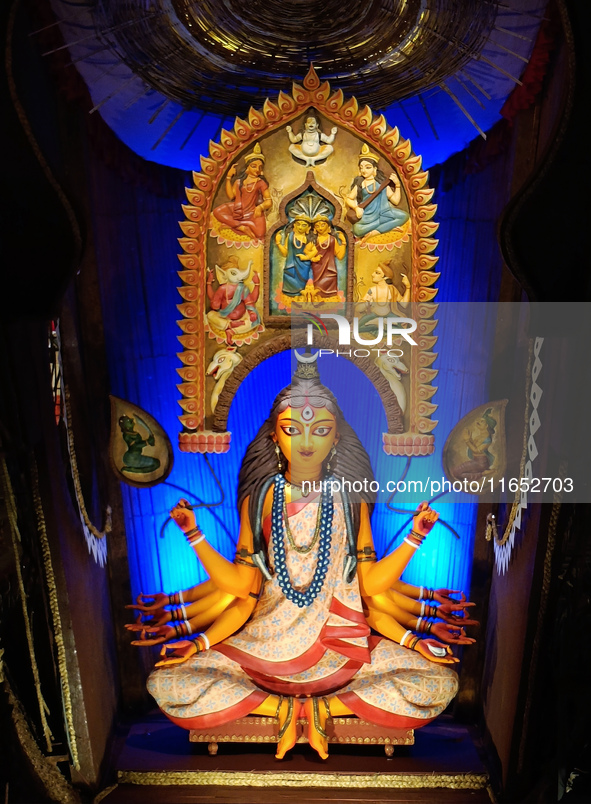 An idol of the Hindu goddess Durga is placed on an altar inside a pandal, marking Durga Puja festival celebrations in Kolkata, India, on Oct...