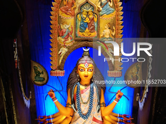 An idol of the Hindu goddess Durga is placed on an altar inside a pandal, marking Durga Puja festival celebrations in Kolkata, India, on Oct...