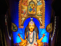 An idol of the Hindu goddess Durga is placed on an altar inside a pandal, marking Durga Puja festival celebrations in Kolkata, India, on Oct...