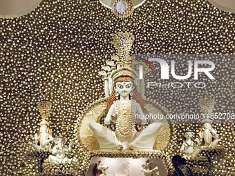 An idol of the Hindu goddess Durga is placed on an altar inside a pandal, marking Durga Puja festival celebrations in Kolkata, India, on Oct...