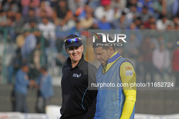 Umpire Billy Bowden (L) reacts during the Legends League Cricket T20 match between Toyam Hyderabad and Southern Superstars at the Bakshi Sta...