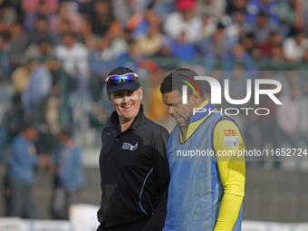 Umpire Billy Bowden (L) reacts during the Legends League Cricket T20 match between Toyam Hyderabad and Southern Superstars at the Bakshi Sta...