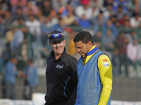 Umpire Billy Bowden (L) reacts during the Legends League Cricket T20 match between Toyam Hyderabad and Southern Superstars at the Bakshi Sta...