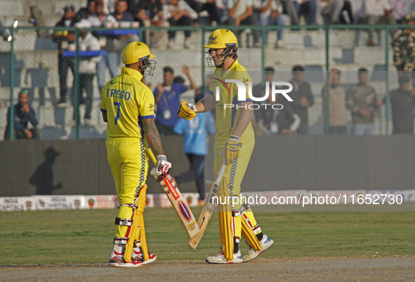 Peter Trego (L) and George Worker (R) of Toyam Hyderabad react during the Legends League Cricket T20 match between Toyam Hyderabad and South...