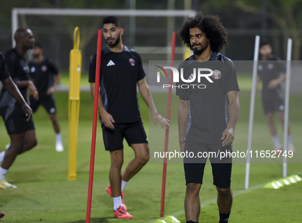 Akram Afif from the Qatar National football team attends a training session at Aspire Academy in Doha, Qatar, on October 9, 2024, ahead of t...