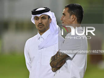 The President of the Qatar Football Association, Jassim bin Rashid Al-Boenain, participates in a training session at Aspire Academy in Doha,...