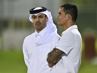 The President of the Qatar Football Association, Jassim bin Rashid Al-Boenain, participates in a training session at Aspire Academy in Doha,...