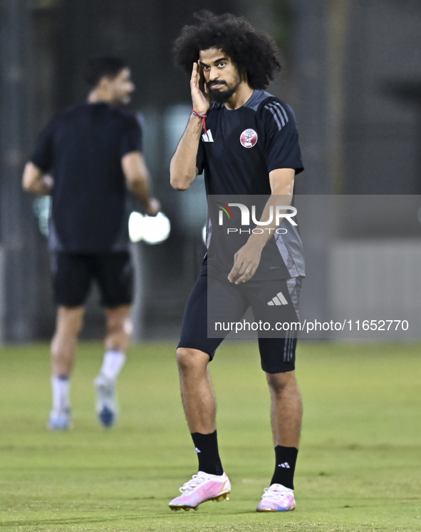 Akram Afif from the Qatar National football team attends a training session at Aspire Academy in Doha, Qatar, on October 9, 2024, ahead of t...