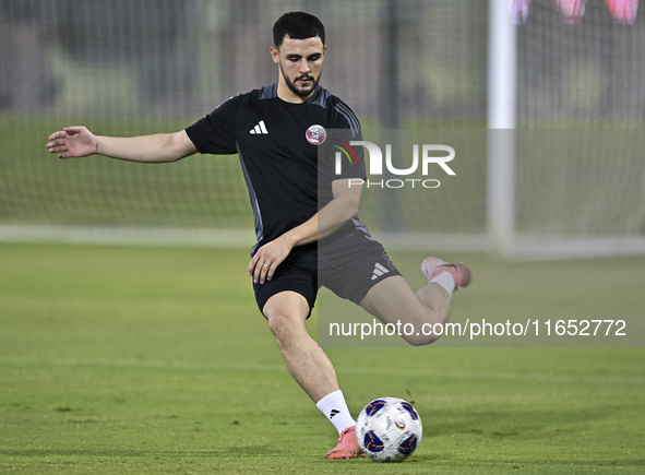 Bassam Al Rawi from the Qatar National football team attends a training session at Aspire Academy in Doha, Qatar, on October 9, 2024, ahead...