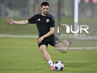 Bassam Al Rawi from the Qatar National football team attends a training session at Aspire Academy in Doha, Qatar, on October 9, 2024, ahead...