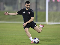 Bassam Al Rawi from the Qatar National football team attends a training session at Aspire Academy in Doha, Qatar, on October 9, 2024, ahead...