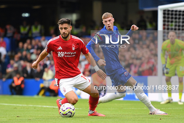 Alex Moreno of Nottingham Forest shields the ball from Cole Palmer of Chelsea during the Premier League match between Chelsea and Nottingham...