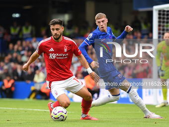 Alex Moreno of Nottingham Forest shields the ball from Cole Palmer of Chelsea during the Premier League match between Chelsea and Nottingham...