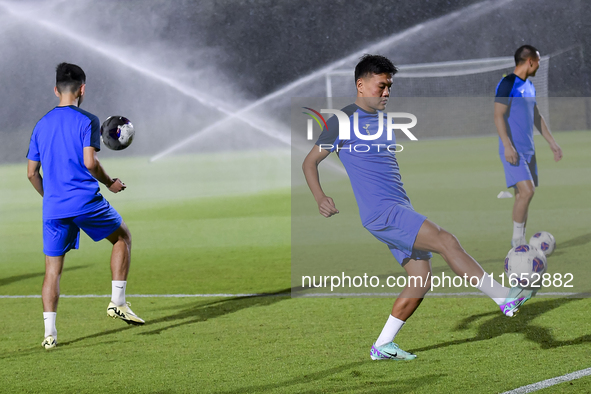 Players of the Kyrgyzstan National team train at Qatar University training pitch in Doha, Qatar, on October 9, 2024, ahead of the FIFA World...