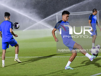 Players of the Kyrgyzstan National team train at Qatar University training pitch in Doha, Qatar, on October 9, 2024, ahead of the FIFA World...