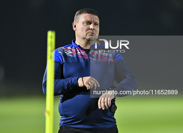 Head coach Maksim Lisitsyn (R) of the Kyrgyzstan National Team attends a training session at Qatar University training pitch in Doha, Qatar,...