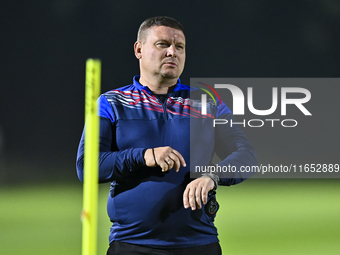 Head coach Maksim Lisitsyn (R) of the Kyrgyzstan National Team attends a training session at Qatar University training pitch in Doha, Qatar,...