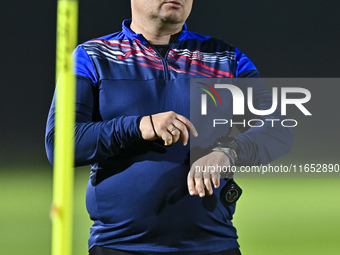 Head coach Maksim Lisitsyn (R) of the Kyrgyzstan National Team attends a training session at Qatar University training pitch in Doha, Qatar,...