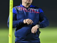 Head coach Maksim Lisitsyn (R) of the Kyrgyzstan National Team attends a training session at Qatar University training pitch in Doha, Qatar,...