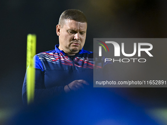 Head coach Maksim Lisitsyn (R) of the Kyrgyzstan National Team attends a training session at Qatar University training pitch in Doha, Qatar,...