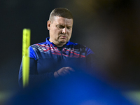 Head coach Maksim Lisitsyn (R) of the Kyrgyzstan National Team attends a training session at Qatar University training pitch in Doha, Qatar,...