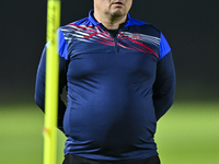 Head coach Maksim Lisitsyn (R) of the Kyrgyzstan National Team attends a training session at Qatar University training pitch in Doha, Qatar,...