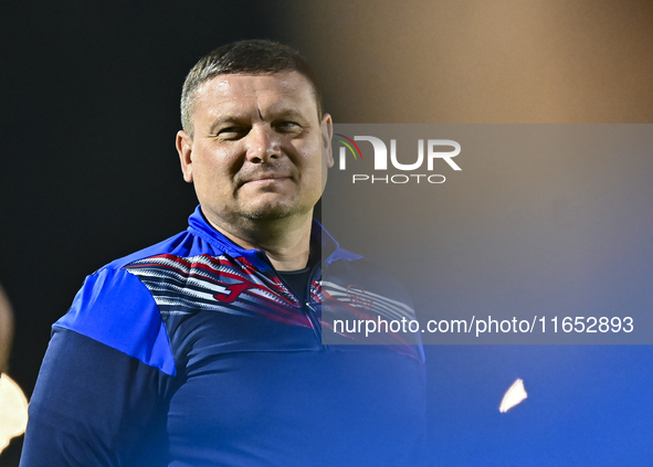 Head coach Maksim Lisitsyn (R) of the Kyrgyzstan National Team attends a training session at Qatar University training pitch in Doha, Qatar,...