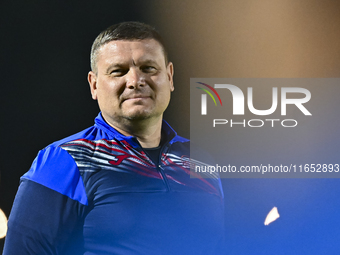 Head coach Maksim Lisitsyn (R) of the Kyrgyzstan National Team attends a training session at Qatar University training pitch in Doha, Qatar,...