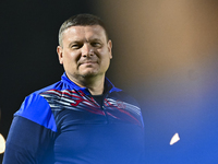 Head coach Maksim Lisitsyn (R) of the Kyrgyzstan National Team attends a training session at Qatar University training pitch in Doha, Qatar,...